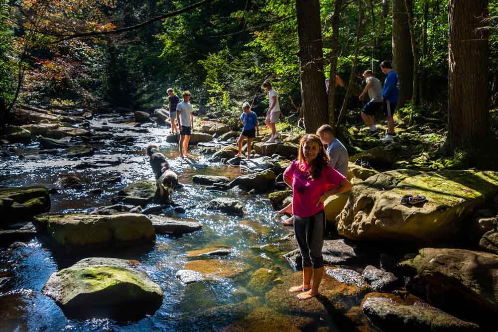 Rocky River photo of a group walking in the river