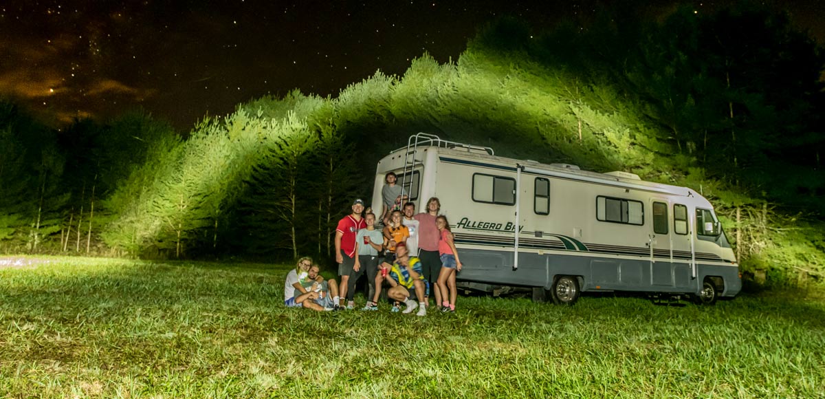 Light painting of an RV parked at a private camp area for a retreat.